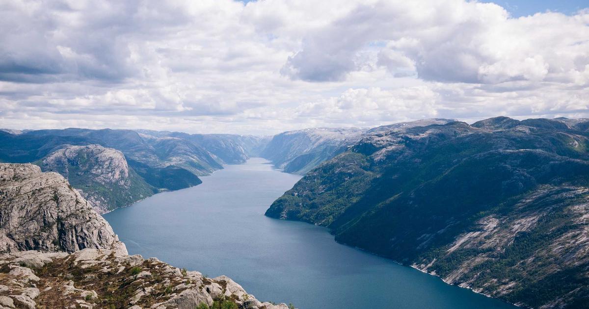 A cozy living room with smart home devices and a family enjoying sustainable living