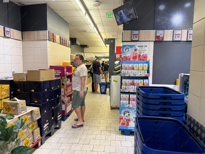 ⁠The busy entrance and grocery aisles of a Lidl supermarket in Paris⁠