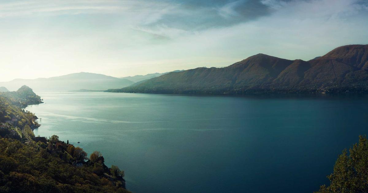 AI dashboard showing energy consumption in a smart home, person interacting with eco-friendly smart devices