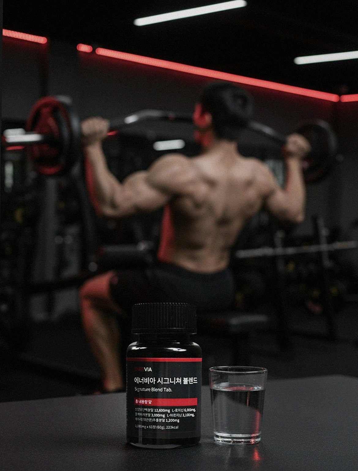 Korean Asian man 30s taking supplement with water early morning