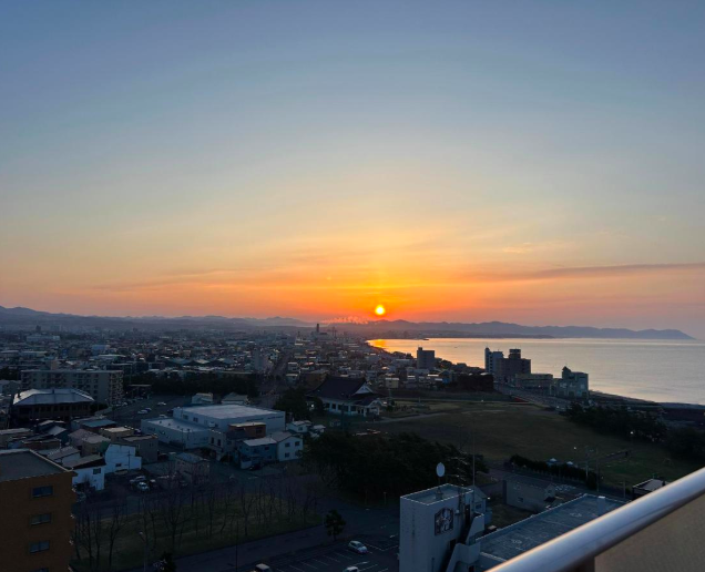 Sunset view from the veranda at Hotel Global View Hakodate with a beautiful twilight sky.