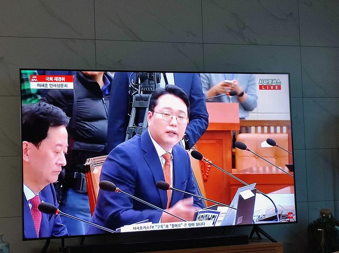 Korean Asian man in 40s office lunch break checking watch