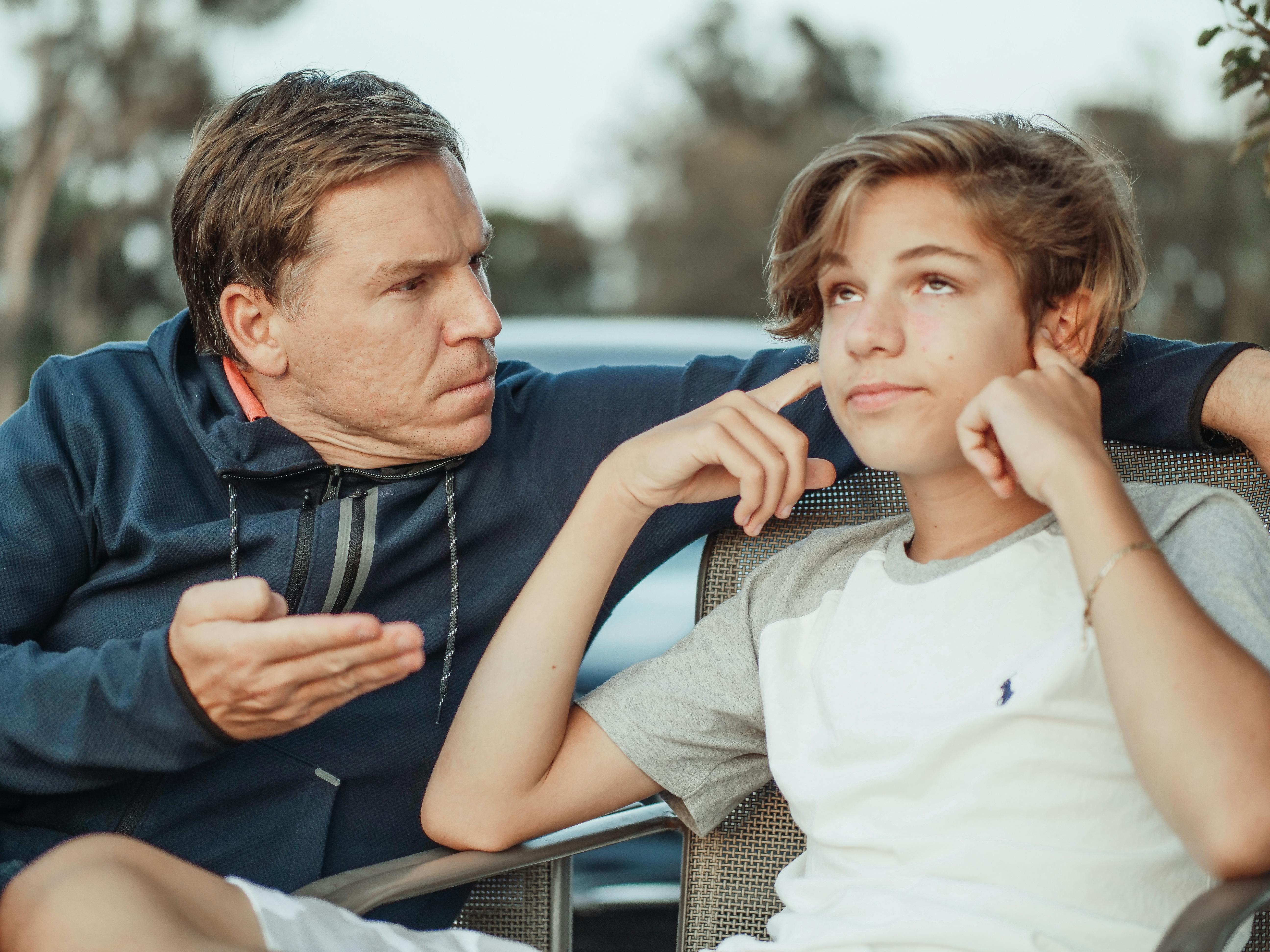 teenage boy ignoring parents