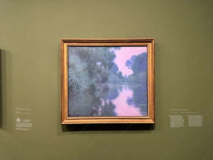 Claude Monet painting Bras de Seine près de Giverny in a gold frame on display.