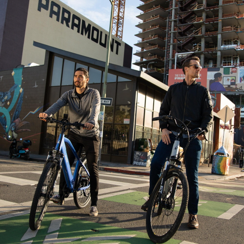 Modern electric bicycle with pedal assist system showing motor and battery components for legal bike path use