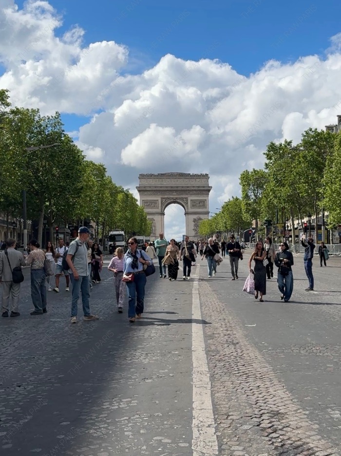pedestrian champs elysees street with arc de triomphe in paris