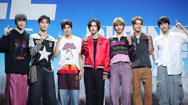 RIIZE members posing for a group concept photo, featuring Anton and other members