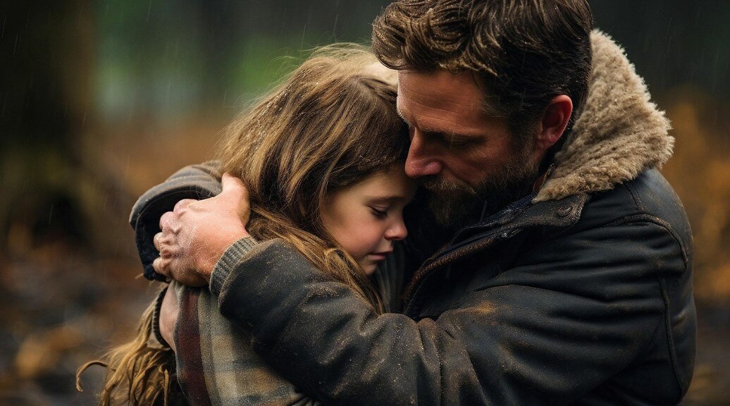 슬퍼하는 어린 딸을 안고 있는 아빠