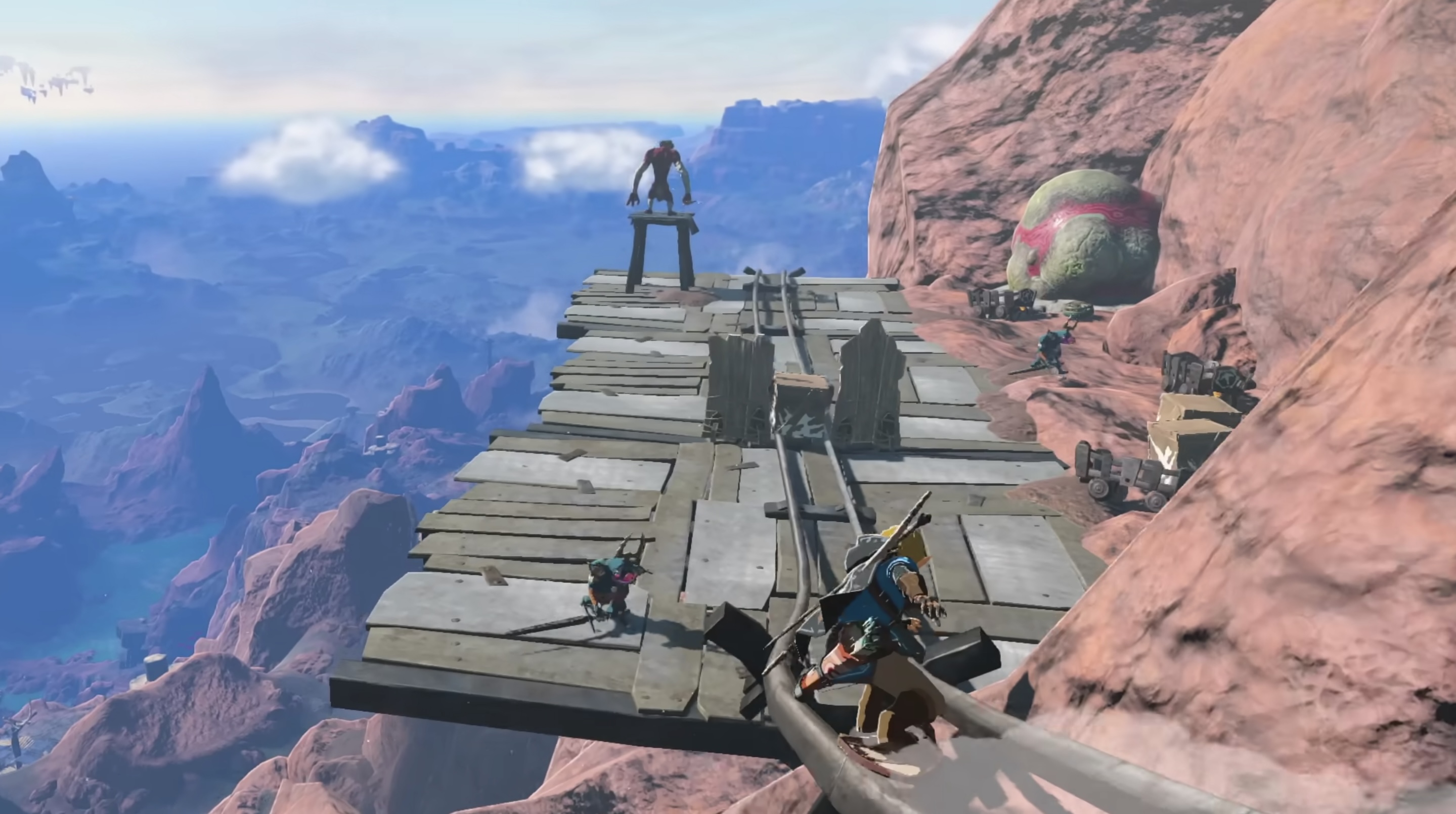 암벽에-설치된-레일을-타고-이동중인-주인공