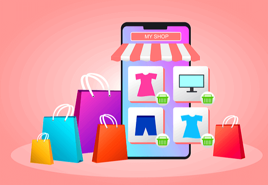 커다란 휴대폰이 세워져 있고 화면에는 의류와 PC 그림이 있다. 주변에는 쇼핑백들이 가득하다.