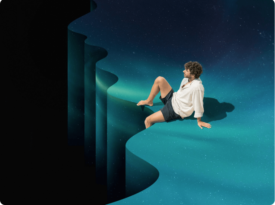 절벽에 혼자 앉아 있는 남성