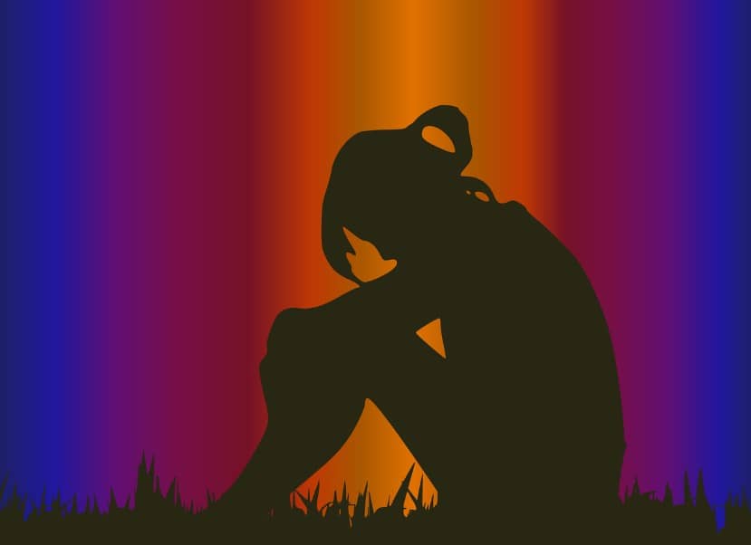 갱년기를 겪는 여성이 느끼는 우울감, 불안, 정서적 고립을 상징적으로 표현한 이미지. 다양한 색상의 배경은 갱년기 동안 변화하는 감정 기복과 심리적 어려움을 시각화