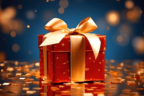 네모난 빨간 선물상자가 황금색 리본으로 포장됐다. 주변엔 금색 작은 별들이 반짝거린다.