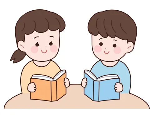 책상에 앉아 책을 읽고 있는 두 아이