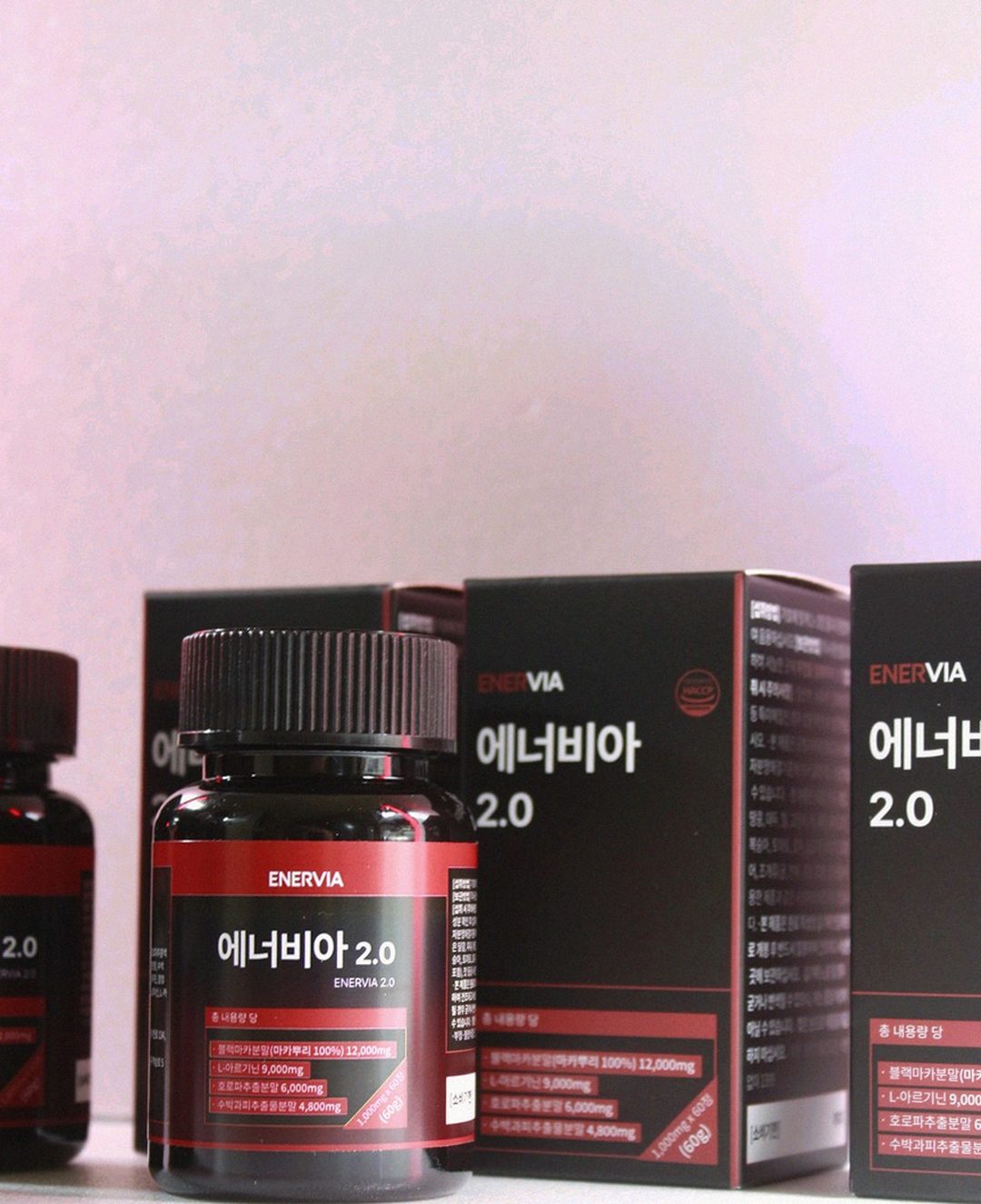Korean Asian man in late 30s taking supplement at office desk