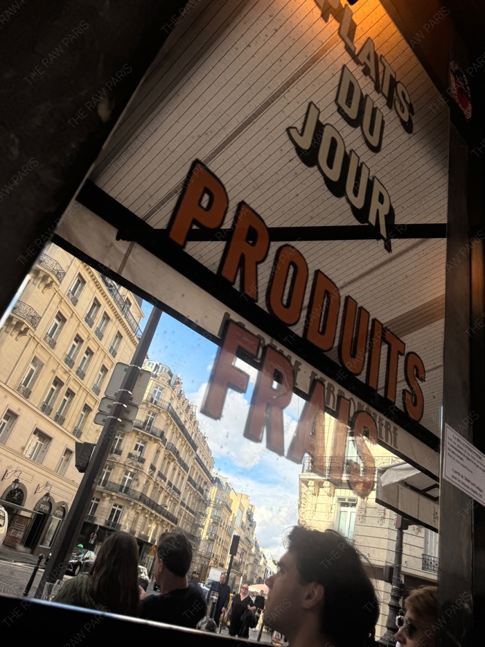 paris street cafe near champs elysees with classic paris buildings