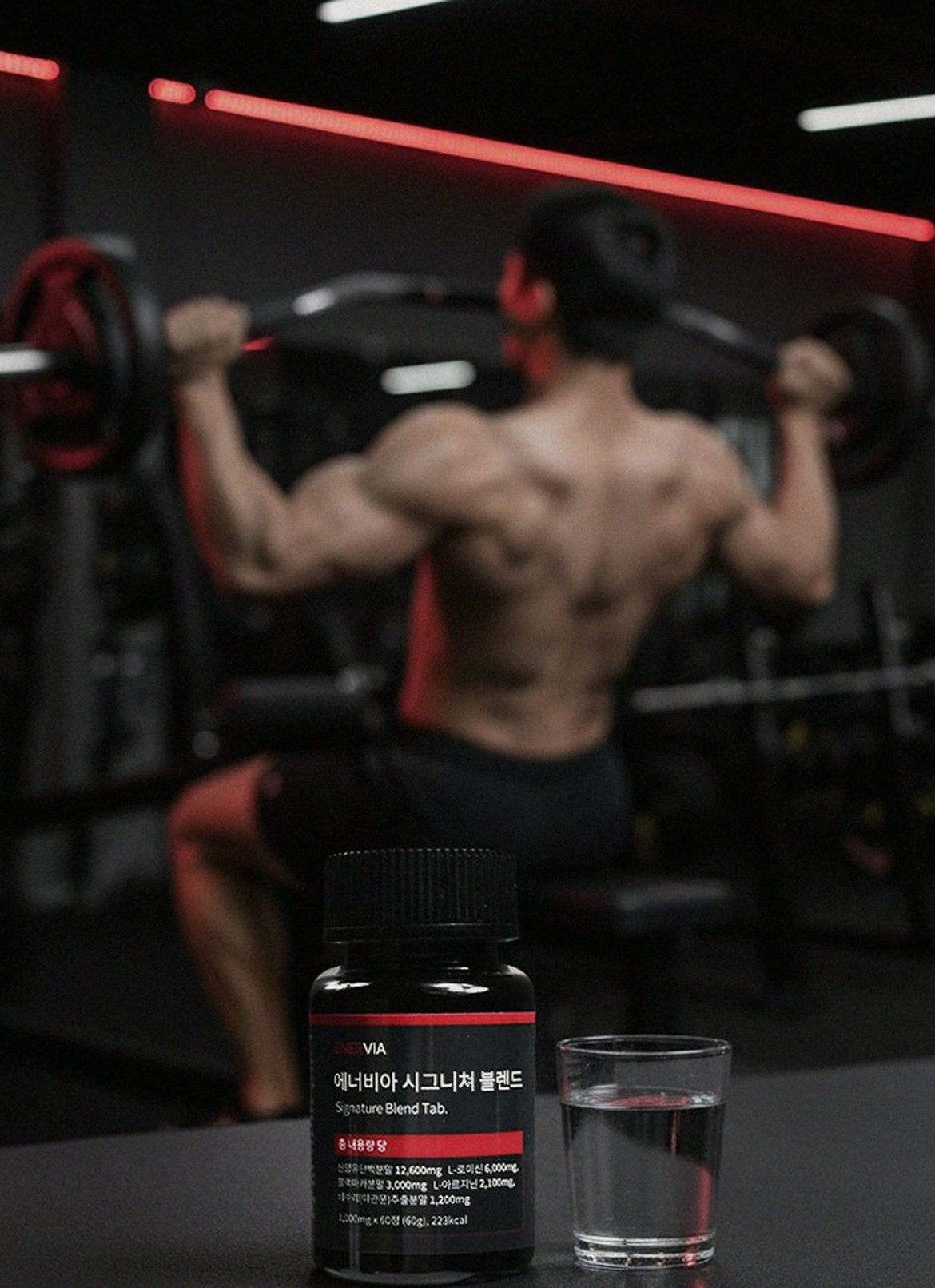 Korean Asian man in late 30s taking supplement before dinner at home