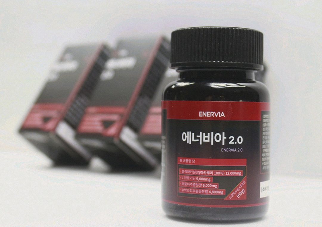 Korean Asian man 42 years old taking supplement after dinner at home