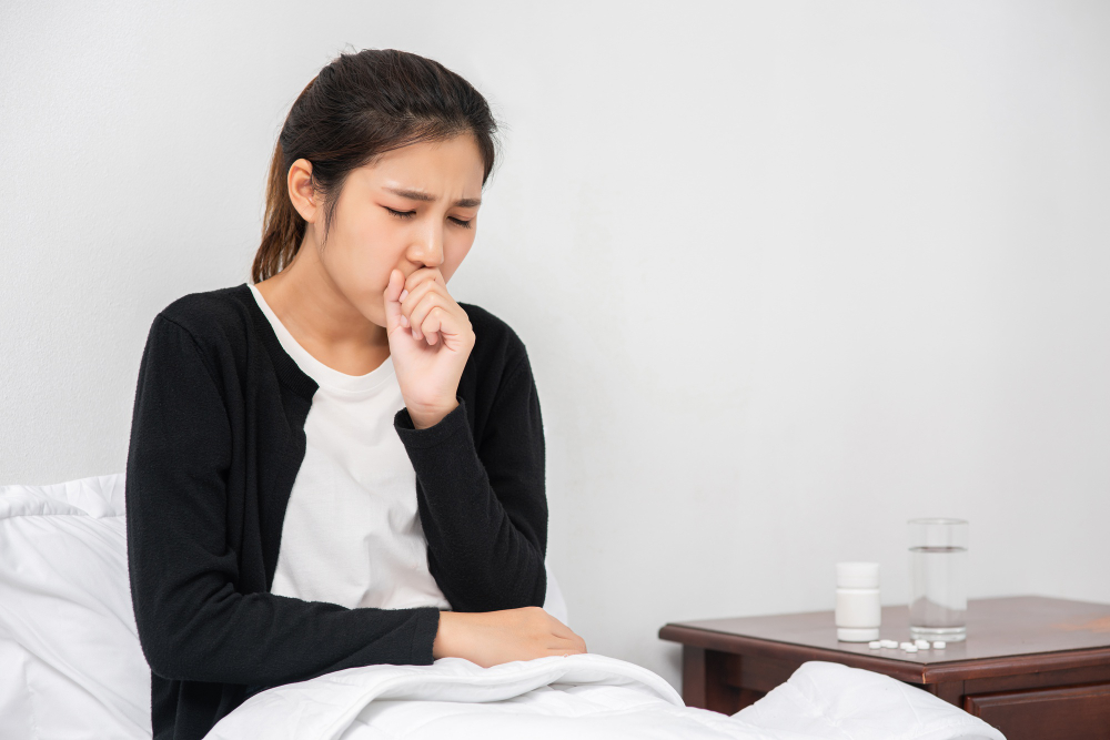 a woman who is coughing
