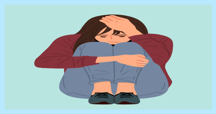 무릎을 끌어안고 고개를 숙인 여성의 그림. 우울감이나 불안감을 표현한 이미지.