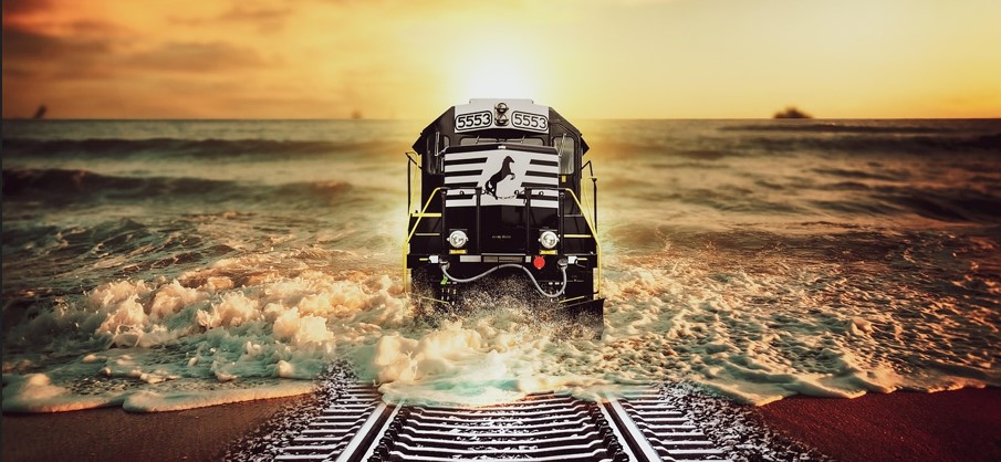 바다로 이어진 철길을 기차가 달리고 있는 만화