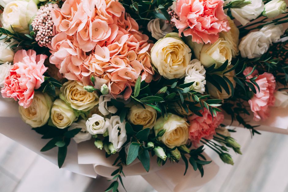 Beautiful close-up of a vibrant floral bouquet featuring hydrangeas, roses, and greenery.