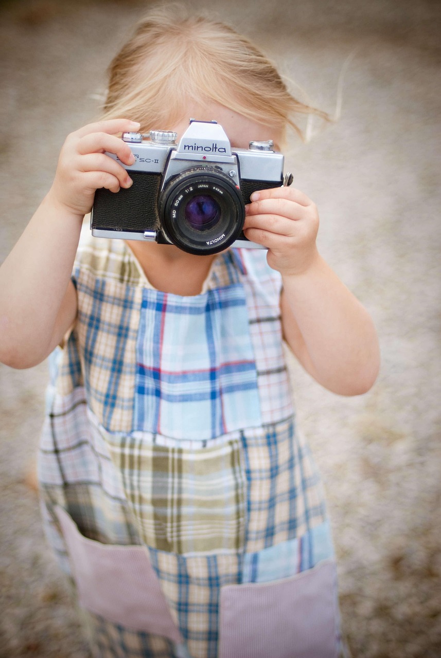 A girl taking pictures with her camera