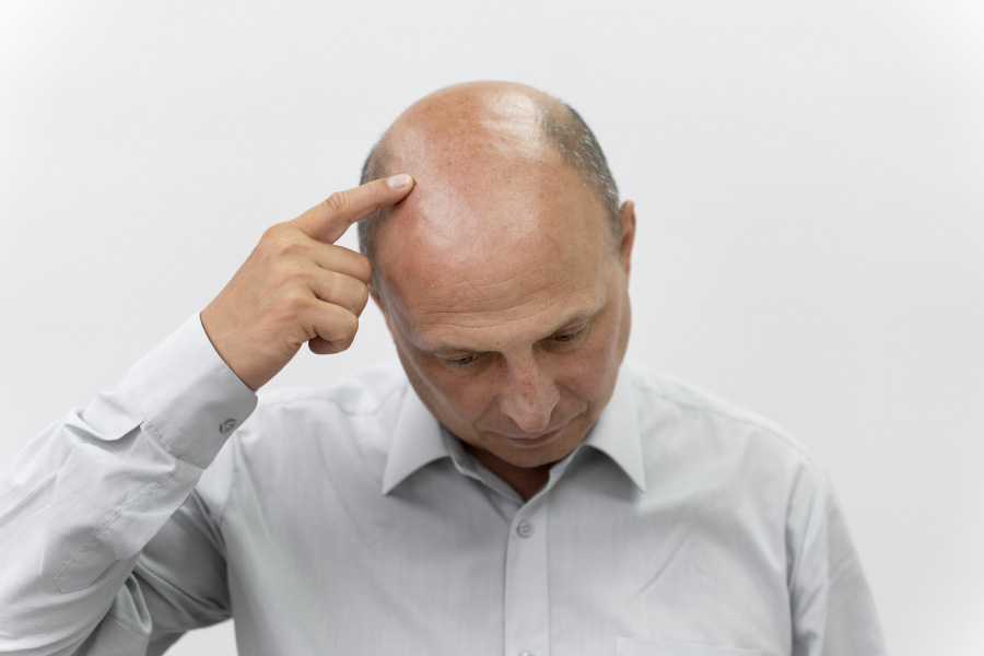man-going-through-follicular-unit-extraction-process-900