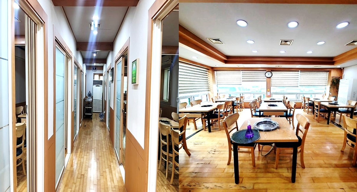 복도를 사이에 두고 길게 이어진 룸들과 넓은 홀에 테이블이 놓인 통영 고성곱창의 깔끔한 실내 모습