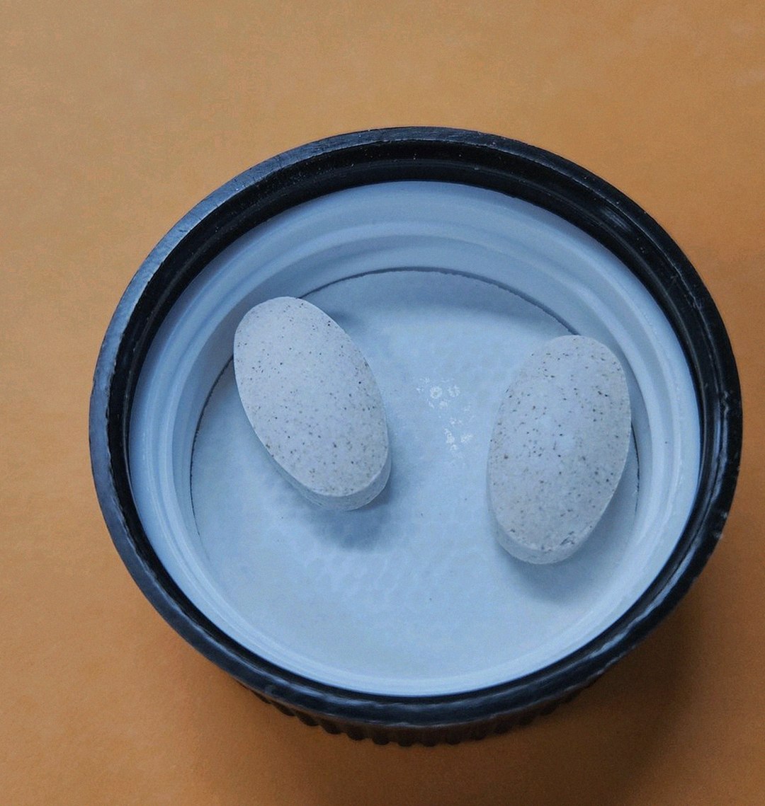 enervia 2.0 supplement bottle on office desk