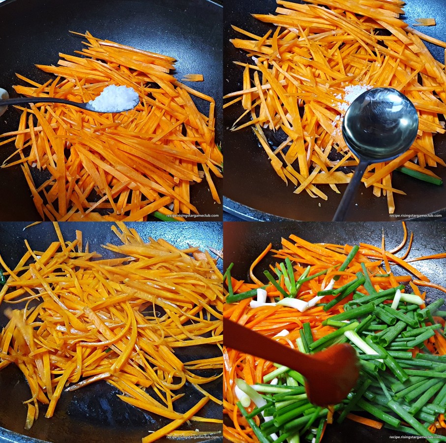 잡채에 들어갈 당근에 소금, 식용유, 쪽파를 넣고 함께 볶아내고 있는 사진