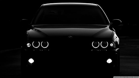 Front angle view of a classic silver BMW 5 Series E39, showcasing its timeless proportions and signature headlights.