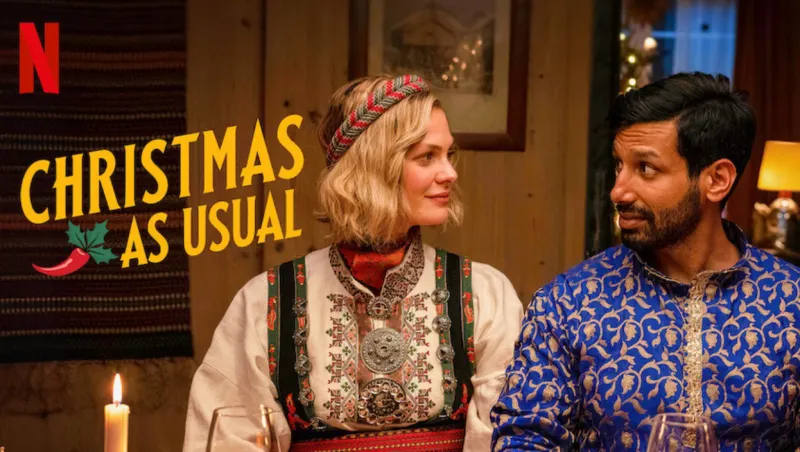 두 남녀가 앉아서 서로 바라보고 있는 영화 그저 평범한 크리스마스