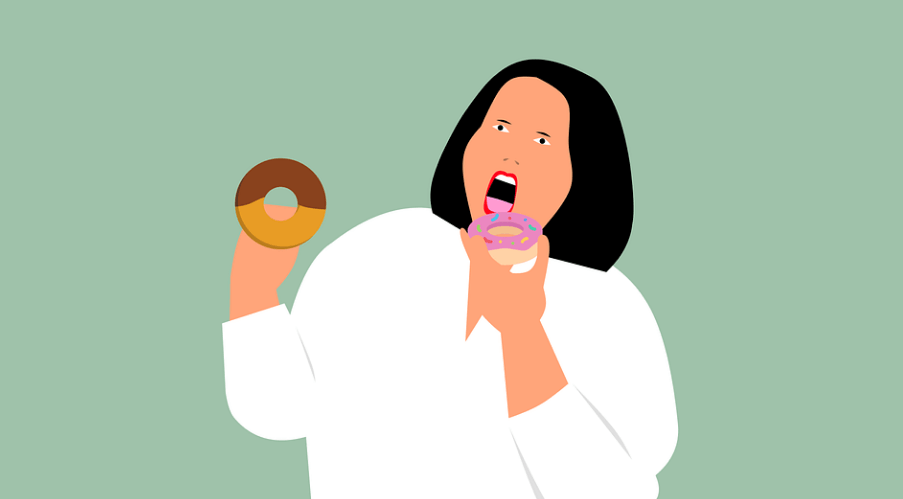 비만인 여성이 도너츠를 먹고 있다