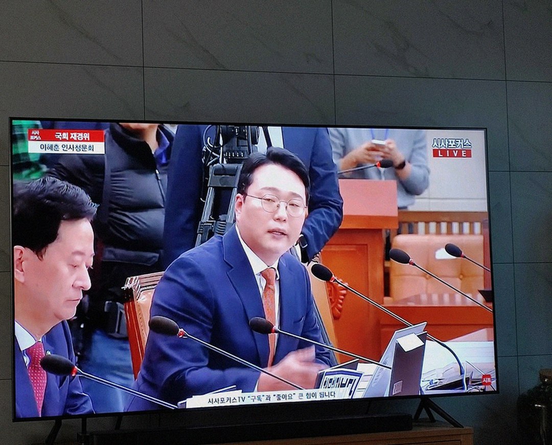 Korean Asian man in 30s lying tired on sofa after work