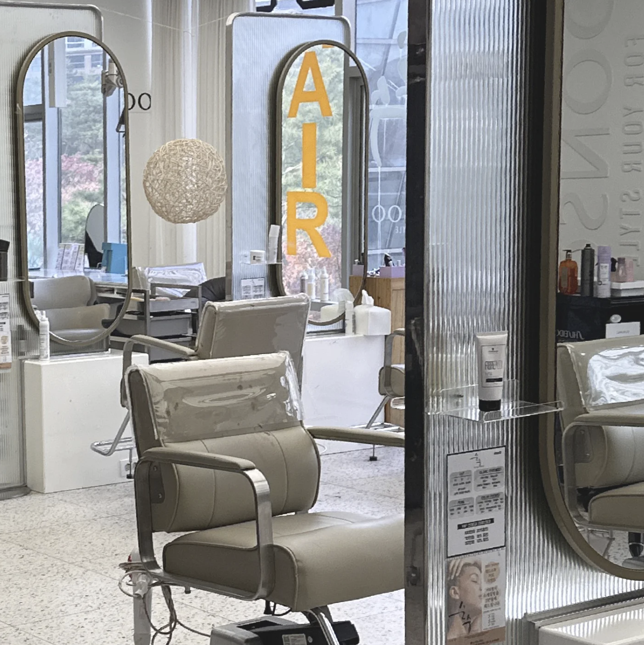 Professional hair salon specializing in gray hair coloring with expert styling chair and premium hair dye products