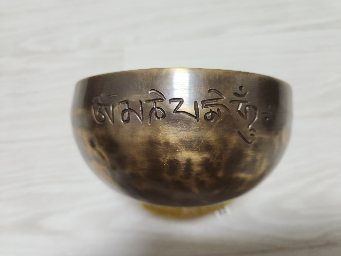 Copper alloy bowl with unknown characters engraved on it