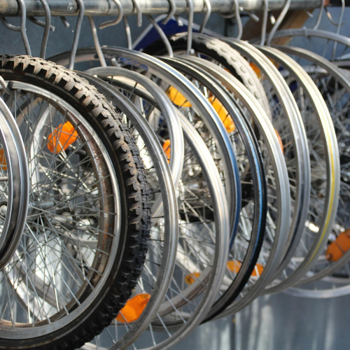 Several bicycle wheelsets are hung on the hangers.
