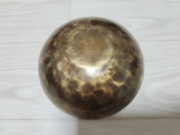 Upside-down view of a copper alloy bowl