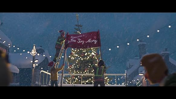 크리스마스트리 앞에서 'Free Sing-Along' 현수막을 거는 사람들