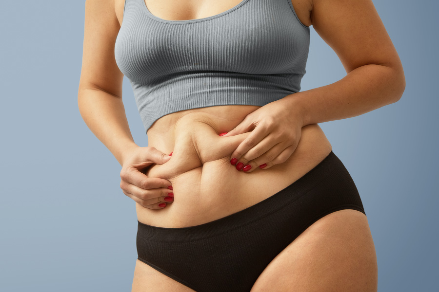 woman-body-fat-belly-obese-woman-hands-holding-excessive-tummy-fat-change-diet-lifestyle-concept-shape-up-healthy-stomach-muscle-studio-anonymous-shot-photo-body-parts-900