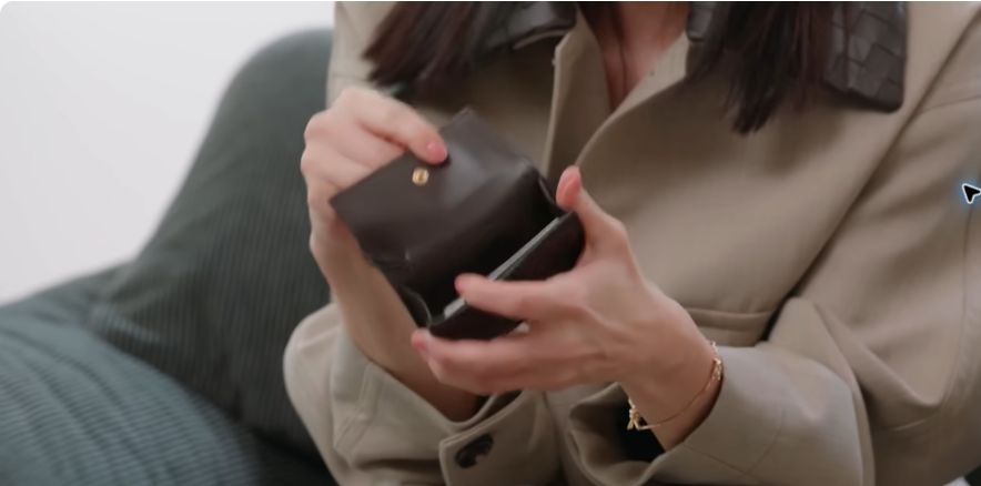 Lee Bo-young opening the card wallet she carried at the time of her Vogue Korea interview