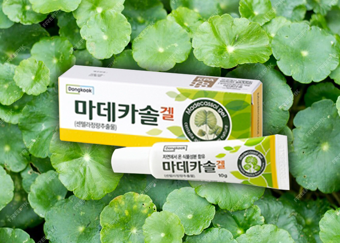 센텔라아시아티카 이미지를 배경으로 마데카솔겔 제품이 놓여져 있다