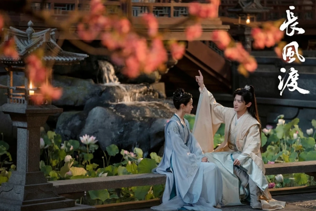 마주앉아-있는-부부-백경정은-하늘로-손가락을-가리키고-있는-모습