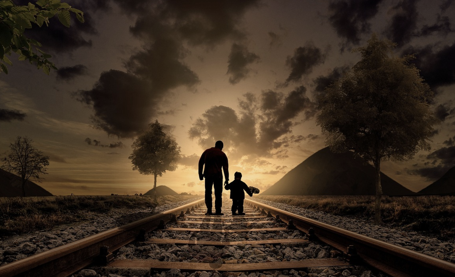 dad and son walking railway