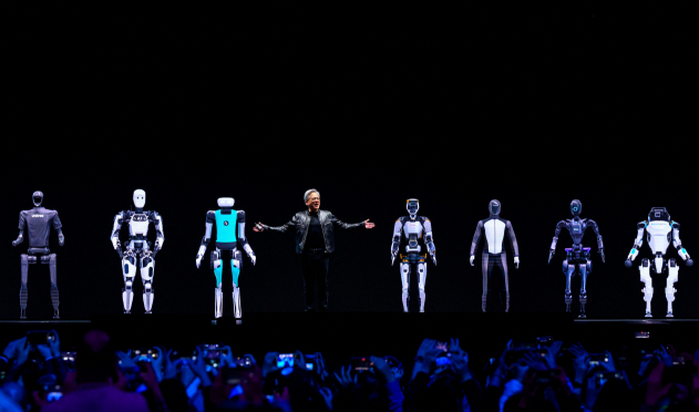 젠슨 황 엔비디아 최고경영지(CEO)가 18일 미국 새너제이에서 진행된 개발자 콘퍼런스에서 AI 로봇 플랫폼을 소개하고 있다.