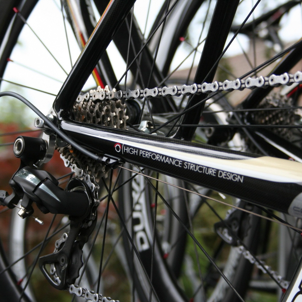 A scene where chain rings and sprockets are engaged in a bicycle drive system