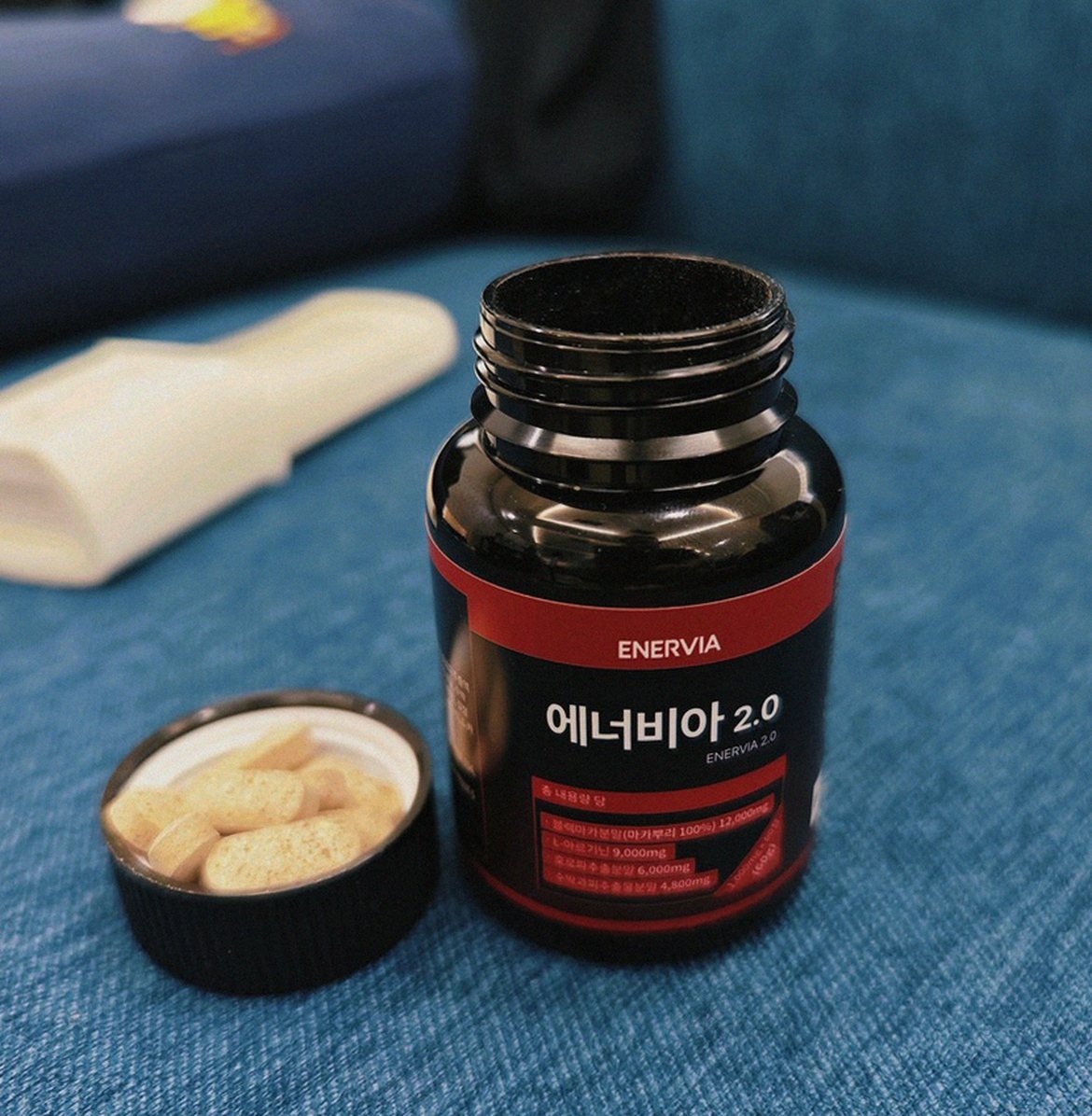 Korean Asian man relaxing at home on Sunday evening with supplements