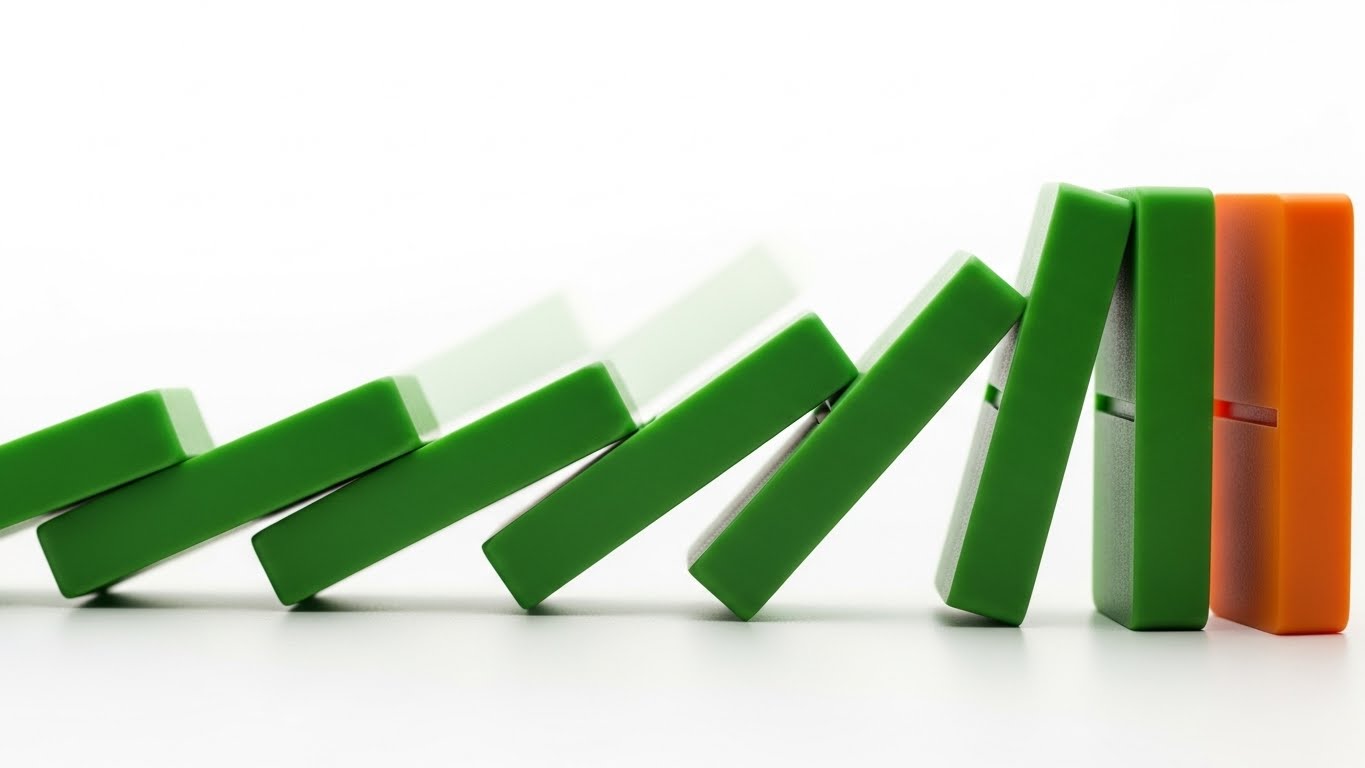 A close-up of green and orange dominoes falling in a line. Smooth motion blur showing cause and effect. Minimalist style, bright lighting.