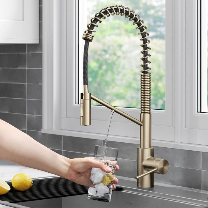 Modern reverse osmosis water purifier in a bright kitchen